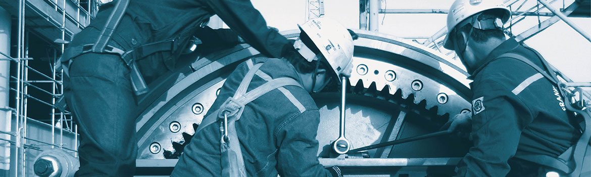 Three working men with winch wheel